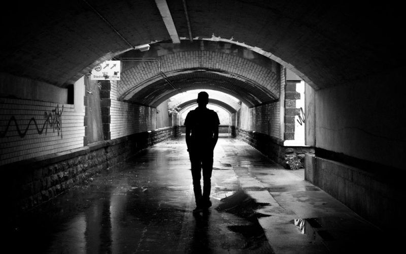 silhouette-photo-of-a-man-in-a-tunnel
