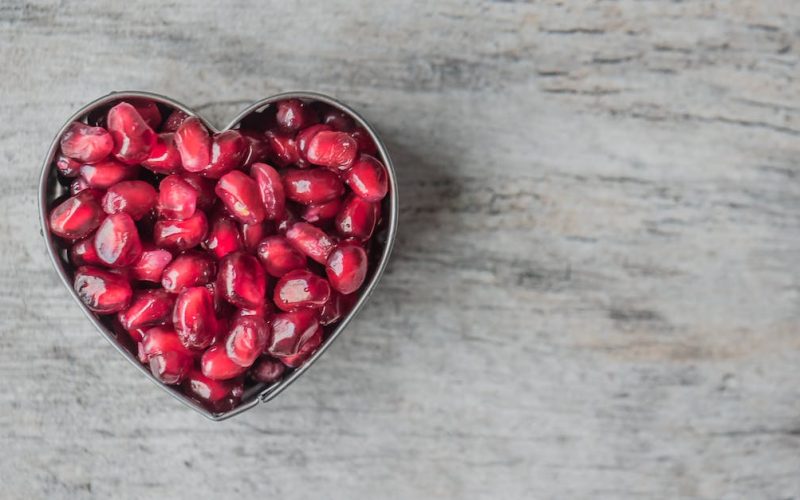 silver-heart-bowl-filled-of-red-pomegranate-seeds